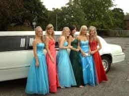 Kids getting into a prom limo